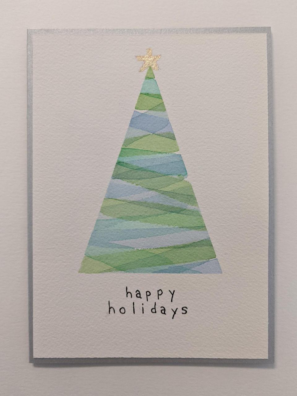 single triangle painted with stripes with a christmas star on the top.