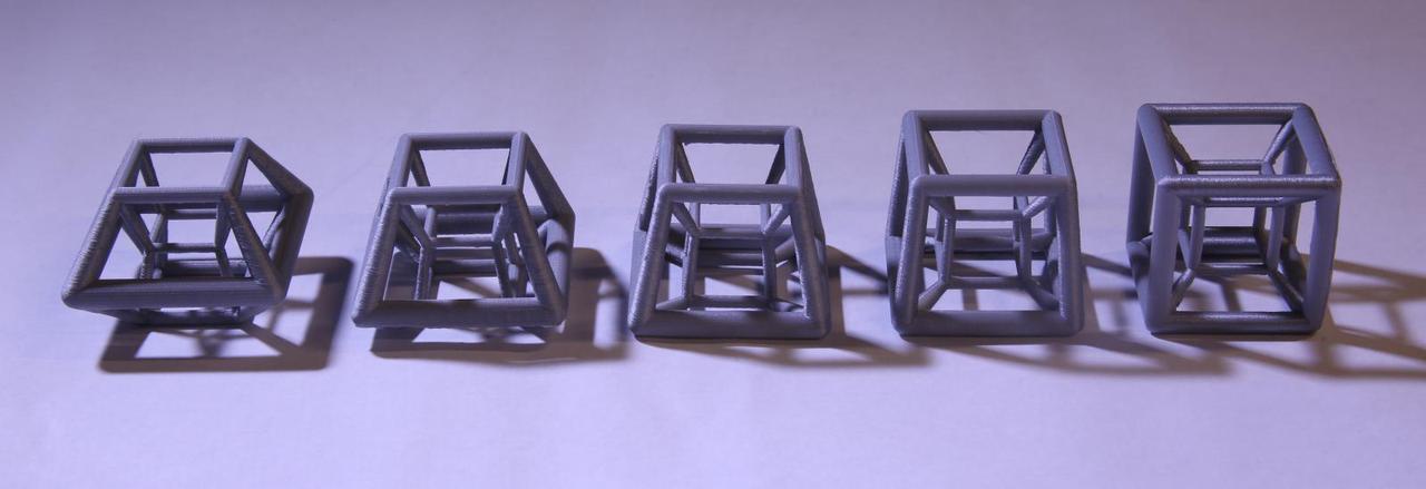 line of five hypercubes in different states of rotation.