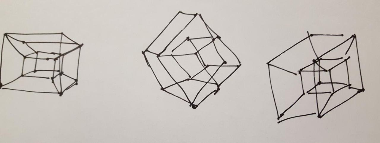Crude attempts at drawing a 4D hypercube on a piece of paper.