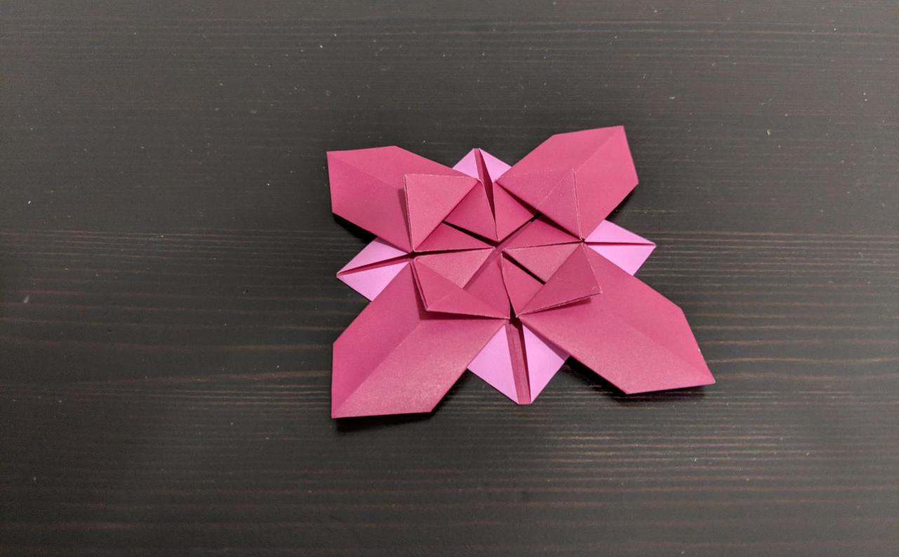 four petal flower made out of paper.