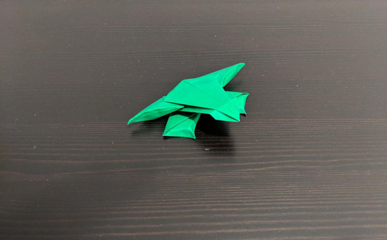 origami frog, with four short stubby legs and a flatish body.