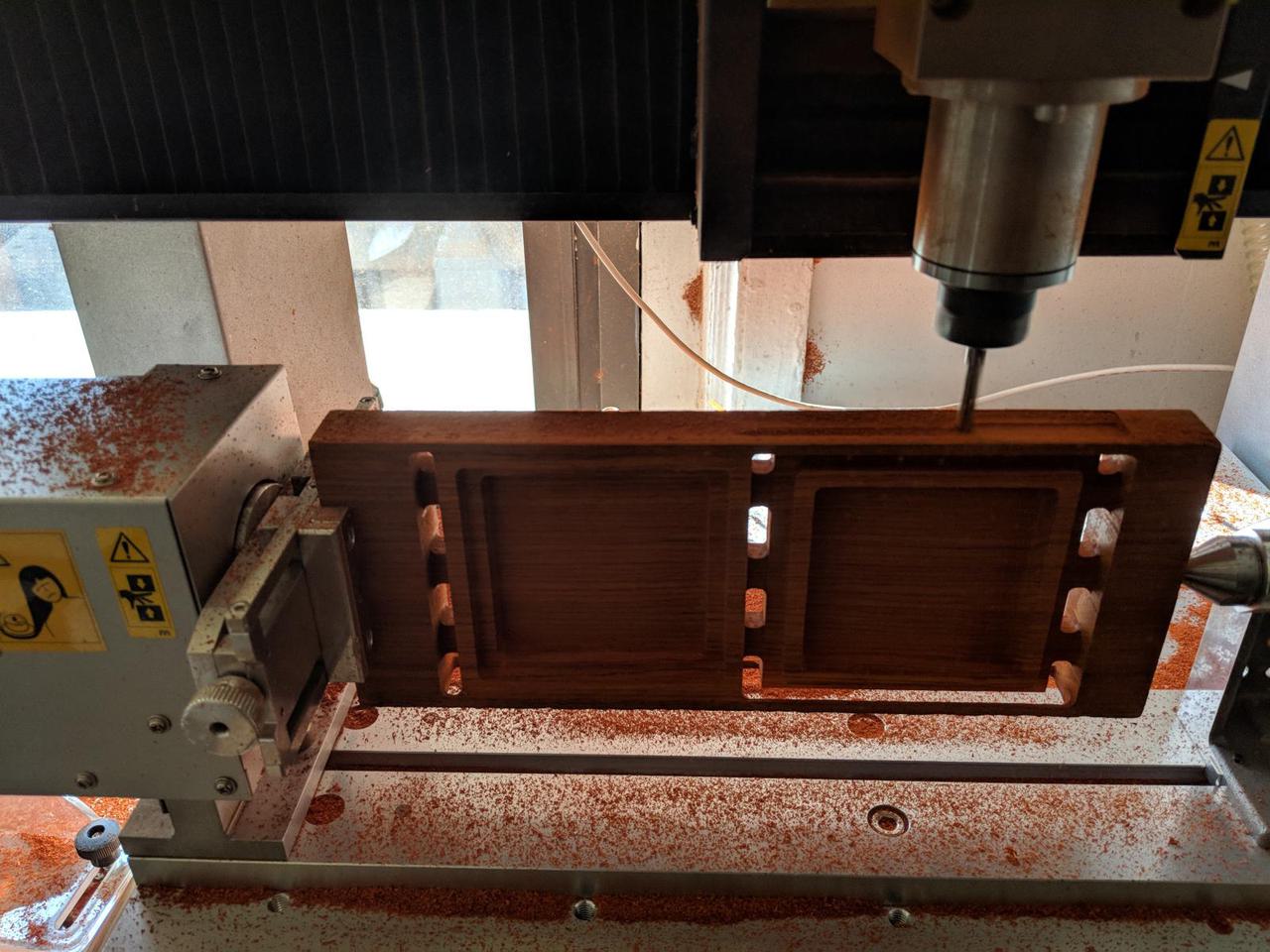 wood rotated 270 degrees and being milled by four axis mill.