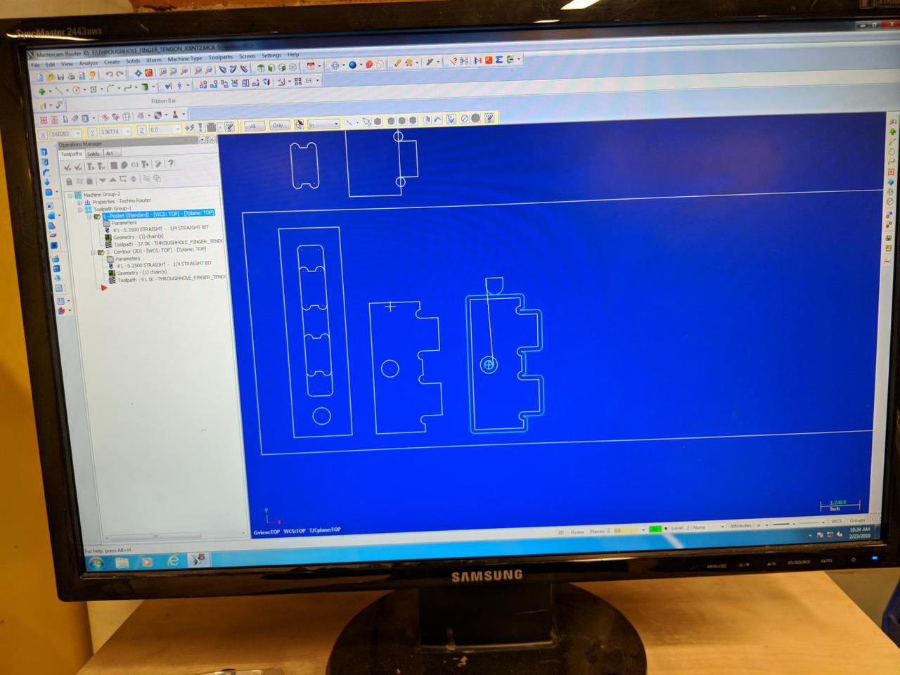 computer screen with design of shapes on it, showing where the CNC will cut.