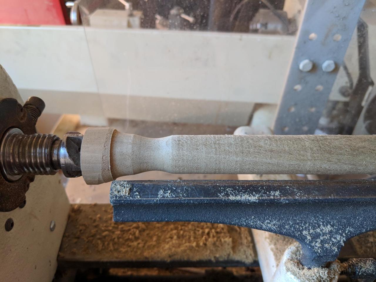 closeup of wooden cylinder with nice curved indentation.