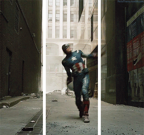 captain america standing in a alley throwing his shield directly at the viewer.