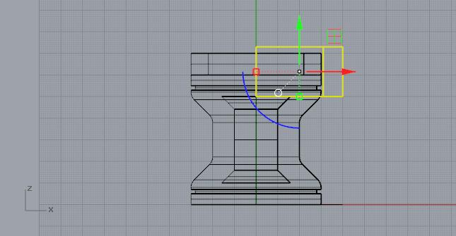 Side view of pedestal with yellow triangle intersecting ring on top