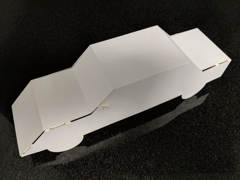 Two images of a paper car. The car is a traditional sedan and is made from heavy white cardstock paper.