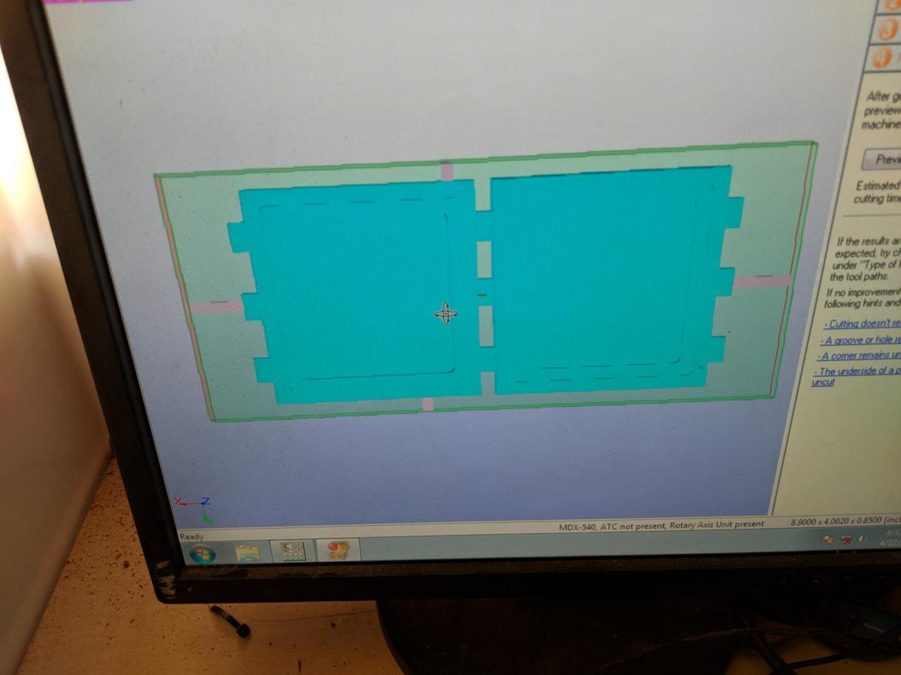 computer monitor showing the design with supports extending out to make the milling region larger.